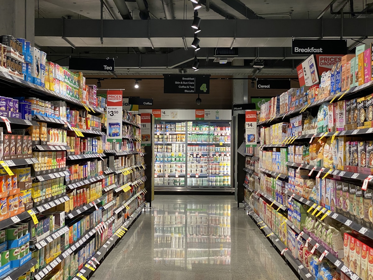 Wide supermarket aisle with shelves — hypermarket scale supply